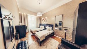 Posteľ alebo postele v izbe v ubytovaní Alfons Boutique Hotel