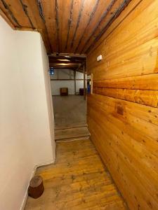 an empty room with wooden walls and a ceiling at Golden View Villa - Great place for vacations in Przesieka