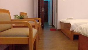 Postel nebo postele na pokoji v ubytování 102 House