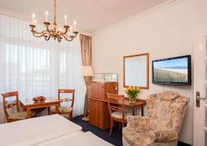 Postel nebo postele na pokoji v ubytování Strandhotel Monbijou GmbH garni