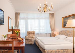 Postel nebo postele na pokoji v ubytování Strandhotel Monbijou GmbH garni