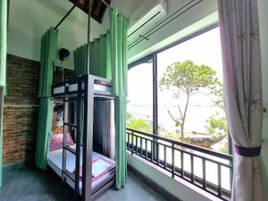 Calm House 2 HOSTEL客房内的一张或多张床位