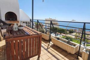 a balcony with plants and a view of the city at Mirador de aguadulce in Aguadulce