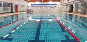 a large swimming pool with a lanespect at Tali Ayer in Nairn