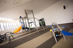 a gym with an empty gym with a slide at Paradigm Residence By The one - upstair of paradigm mall JB in Johor Bahru