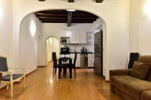 a kitchen and living room with a table and chairs at Elite Rome apartments 3 in Rome