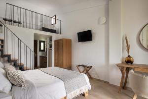 Postel nebo postele na pokoji v ubytování Bungalows Iphigenia