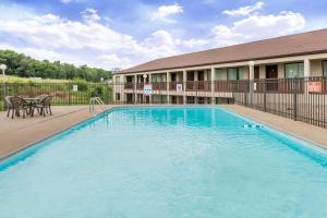 a swimming pool in front of a hotel at Days Inn by Wyndham Hannibal in Hannibal