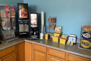 a kitchen with a counter with a coffee maker on it at Days Inn by Wyndham Hannibal in Hannibal