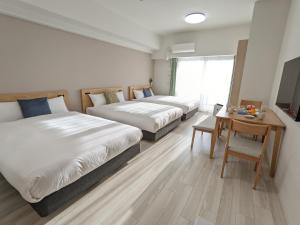 Ένα ή περισσότερα κρεβάτια σε δωμάτιο στο ESLEAD HOTEL Namba Daikokucho +25 φωτογραφίες