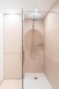 a shower with a glass door in a bathroom at Rooms & Suites Loft 2F Deluxe Edition Arrecife in Arrecife