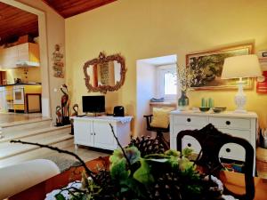 a living room with a couch and a table at Casa das Azenhas by Lisbon Village Apartments in Sintra