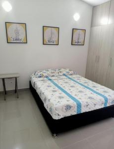 מיטה או מיטות בחדר ב-Hermosa Casa con Aire Acondicionado y WI-FI