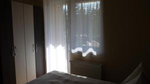 Posteľ alebo postele v izbe v ubytovaní Azur Wellness Apartman