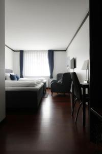 Een bed of bedden in een kamer bij Helnan Phønix Hotel