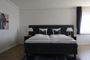 Een bed of bedden in een kamer bij Helnan Phønix Hotel