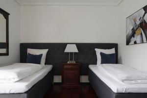 Een bed of bedden in een kamer bij Helnan Phønix Hotel