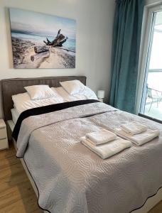 Posteľ alebo postele v izbe v ubytovaní Apartament nad morzem BAY VIEW