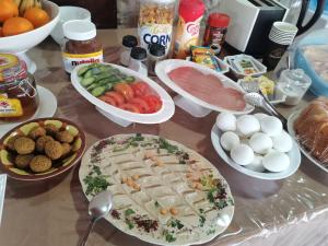 a table topped with lots of different types of food at Madaba Camp Resort in Madaba