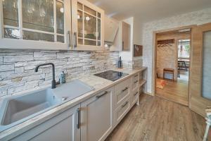 a kitchen with a sink and a counter top at Berg Apartments in Oberreichenbach