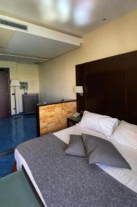 Postel nebo postele na pokoji v ubytování Hotel La Lucertola