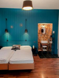 Postel nebo postele na pokoji v ubytování Easy Stay by Hotel La Perla