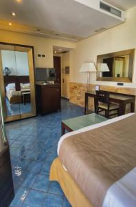 Postel nebo postele na pokoji v ubytování Hotel La Lucertola