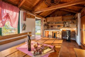 a kitchen with a table with a plate of food at Villa Big Garden in Primorski Dolac