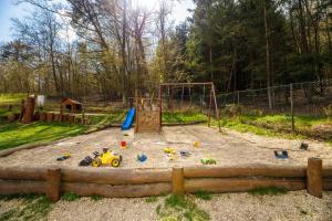 a playground with a toy car in the sand at Pod Břesteckou skalou in Břestek