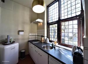 Kuchyň nebo kuchyňský kout v ubytování city Apartment "Op de Thermen" + 17 fotografií
