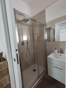 a bathroom with a shower and a sink at Iris Casa Vacanza in Noci