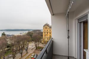 an apartment balcony with a view of a building at App Sophia in Pula