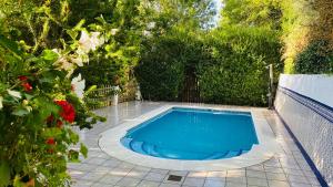a small swimming pool in a yard with a fence at Barranco de la Salud in Laroles