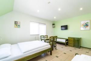Postel nebo postele na pokoji v ubytování Villa & Domek Maja