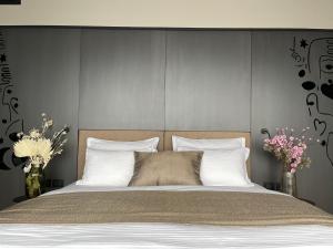 Postel nebo postele na pokoji v ubytování Arka Art Hotel