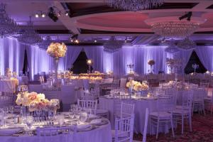 a wedding reception with white tables and chairs and chandeliers at Four Seasons Hotel Westlake Village in Westlake Village +60 photos