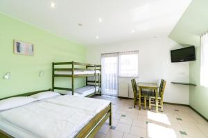 Postel nebo postele na pokoji v ubytování Villa & Domek Maja