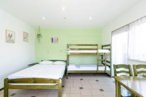 Postel nebo postele na pokoji v ubytování Villa & Domek Maja