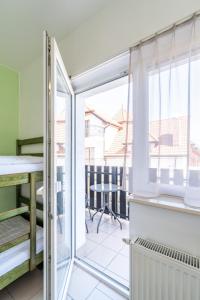 Postel nebo postele na pokoji v ubytování Villa & Domek Maja