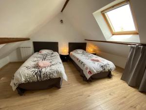 Posteľ alebo postele v izbe v ubytovaní Petite maison dans la prairie