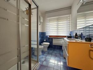a bathroom with a sink and a toilet in it at Anema & Core Home in Porto SantʼElpidio