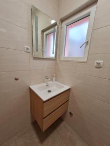 Koupelna v ubytování Apartments Čobanov