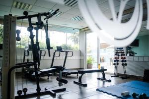 a gym with several tread machines in a room at Vitoria Regia Hotel Bauru in Bauru