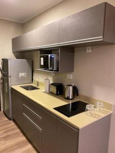 Η κουζίνα ή μικρή κουζίνα στο Apart Casa De Playa Premium +18 φωτογραφίες