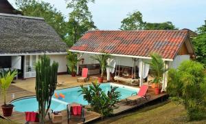 an aerial view of a house with a swimming pool at Nathylodge in Bocas del Toro