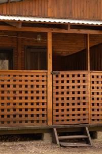 a front door of a wooden building at Domek letniskowy nr 1 Przewięź in Augustów