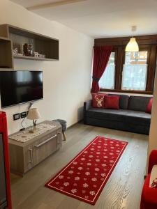 A television and/or entertainment centre at Dolomites Holiday Home
