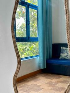 a snake crawling around a window in a room at IRINI Boutique Homestay Mui Ne in Mui Ne