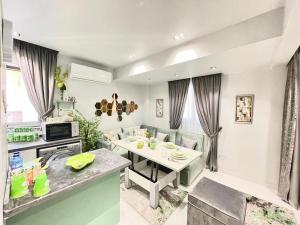 a kitchen and living room with a table and chairs at Luxury Studio House 589-3 in 6th Of October