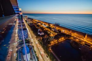 an overhead view of a city with traffic at night at Batumi City Apartments in Batumi